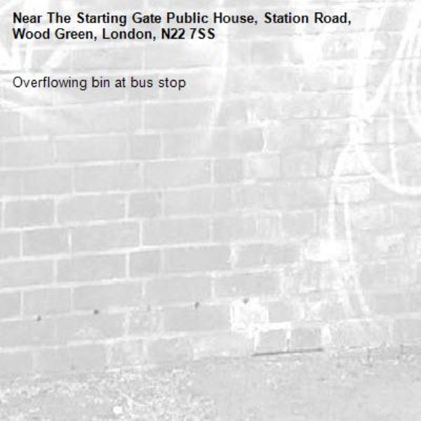 Overflowing bin at bus stop -The Starting Gate Public House, Station Road, Wood Green, London, N22 7SS