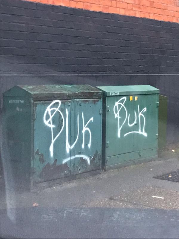 Spray painted tags are painted on a green metal cabinet x4 on Sutherland Avenue junction The Avenue W13-69 The Avenue, West Ealing, W13 8JR