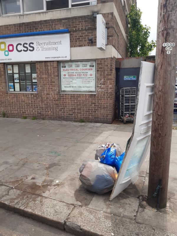 Fly tipped waste couple if bags a d a double glazed door O/S No 292-294 Plashet Grove E6 at High St Nth end - Please clear -Holly Blue House, 249 Plashet Grove, East Ham, London, E6 1DH