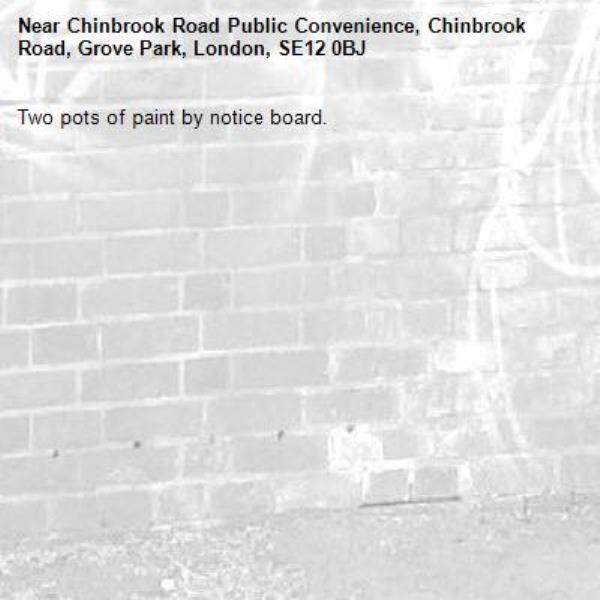 Two pots of paint by notice board. -Chinbrook Road Public Convenience, Chinbrook Road, Grove Park, London, SE12 0BJ