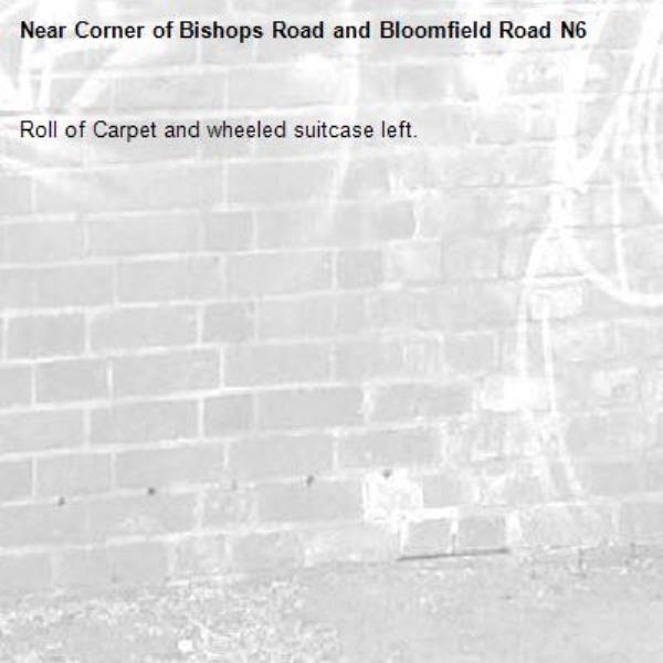 Roll of Carpet and wheeled suitcase left.-Corner of Bishops Road and Bloomfield Road N6