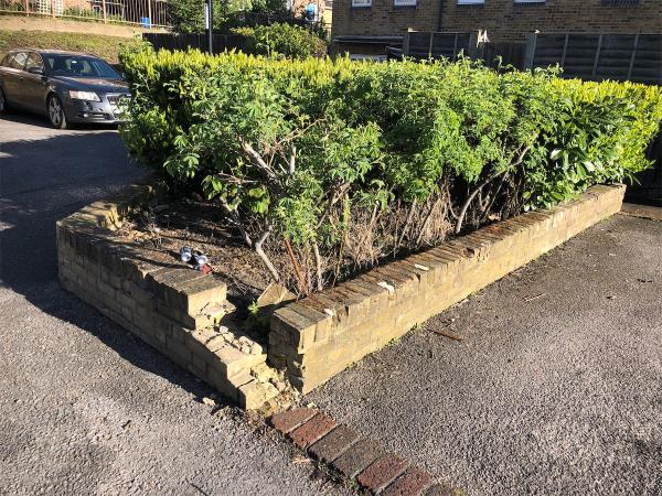Repair damage brick planter in car park opposite property-17 Silverdale, London, SE26 4SD