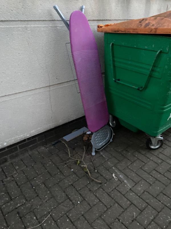 Ironing board by the recycling bin -Russell Flint House, 2 Pankhurst Avenue, Canning Town, E16 1UT