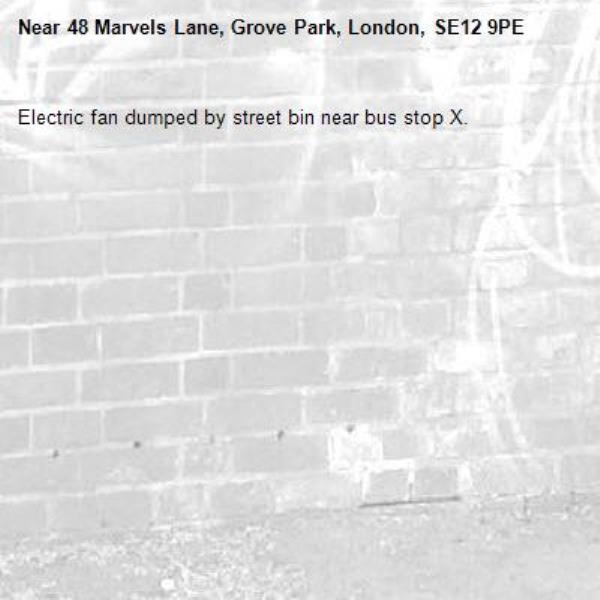 Electric fan dumped by street bin near bus stop X.-48 Marvels Lane, Grove Park, London, SE12 9PE