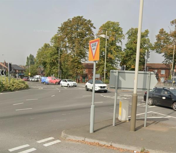 Both give way signs at roundabout have issues one is completely covered by over grown hedges and other is been moved and facing wrong way -1 Stonesby Avenue, Leicester, LE2 6TX