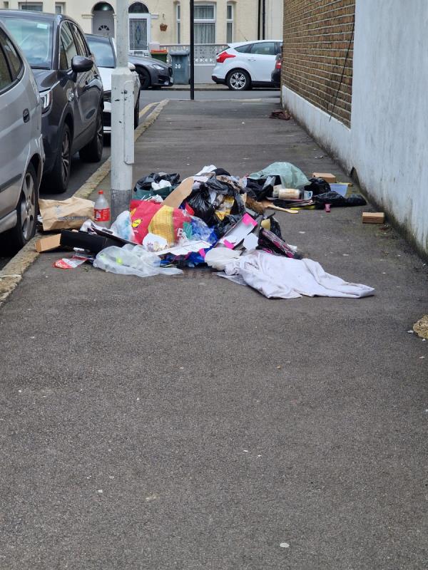 Rubbish dumped on pavement -66 Woodstock Road, Forest Gate, London, E7 8ND