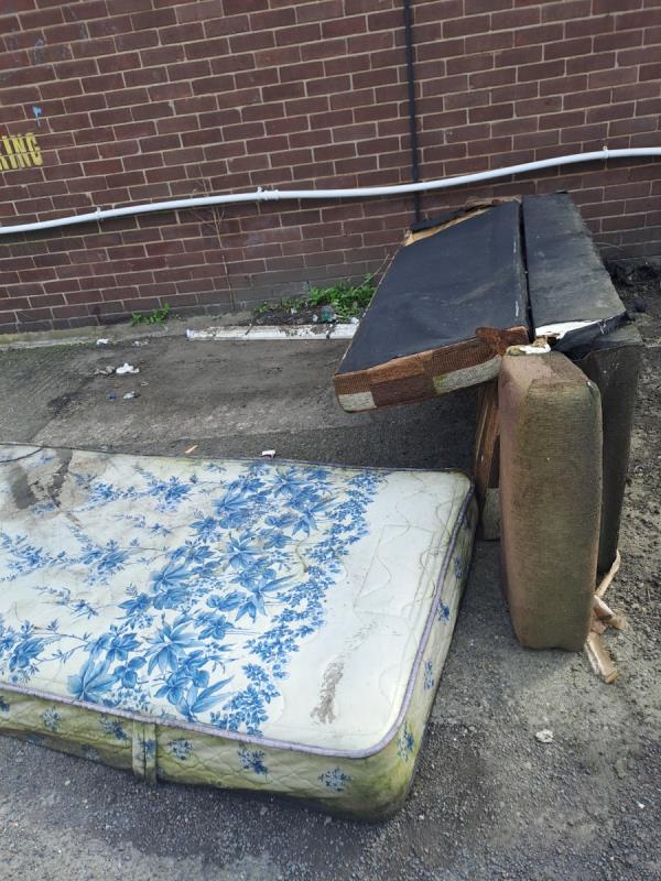 Sofa and mattress dumped outside St Gabrielle Church Rushymead -Gipsy Lane Service Road, Leicester