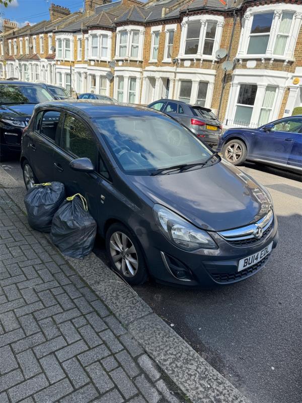 Following my earlier report I could not leave the victim’s property strewn on the street. I have bagged it and left  it next to the car. I have not wanted to touch the car in fear of disturbing the crime scene-Flat First Floor, 82 Harbut Road, London, SW11 2RE