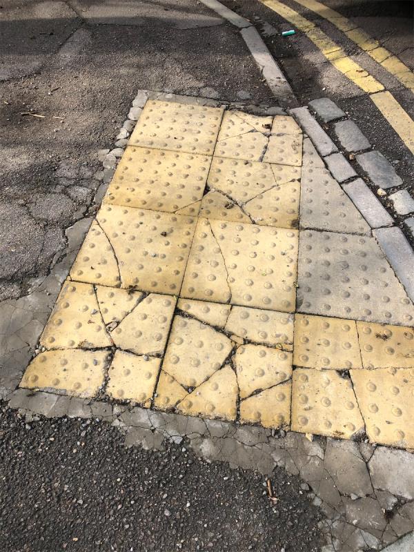 Junction of River Park Garden . Tack tile pavement on crossing is  in poor condition cracked and loose-36 Ravensmead Road, Bromley, BR2 0BT