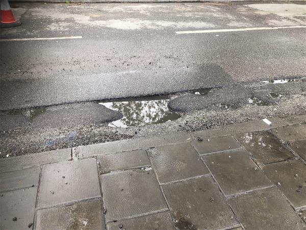 Please repair pot holes near junction with Chinbrook Road-212 Marvels Lane, Grove Park, London, SE12 9PS