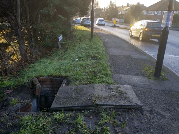 Missing manhole cover and trip.hazard on pavement-Windmill Lane, London, UB2 4NE