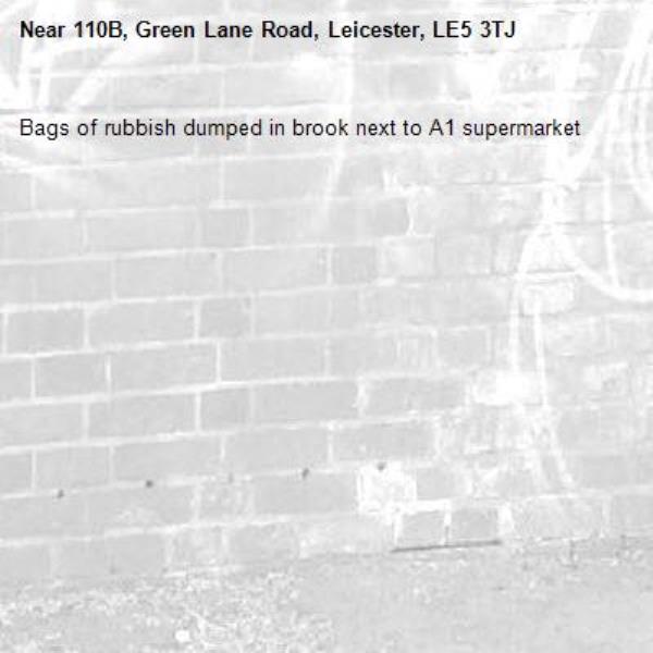 Bags of rubbish dumped in brook next to A1 supermarket -110B, Green Lane Road, Leicester, LE5 3TJ