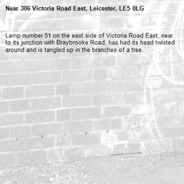 Lamp number 51 on the east side of Victoria Road East, near to its junction with Braybrooke Road, has had its head twisted around and is tangled up in the branches of a tree.-306 Victoria Road East, Leicester, LE5 0LG