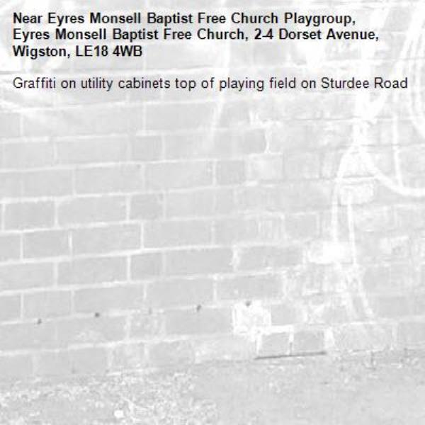 Graffiti on utility cabinets top of playing field on Sturdee Road-Eyres Monsell Baptist Free Church Playgroup, Eyres Monsell Baptist Free Church, 2-4 Dorset Avenue, Wigston, LE18 4WB