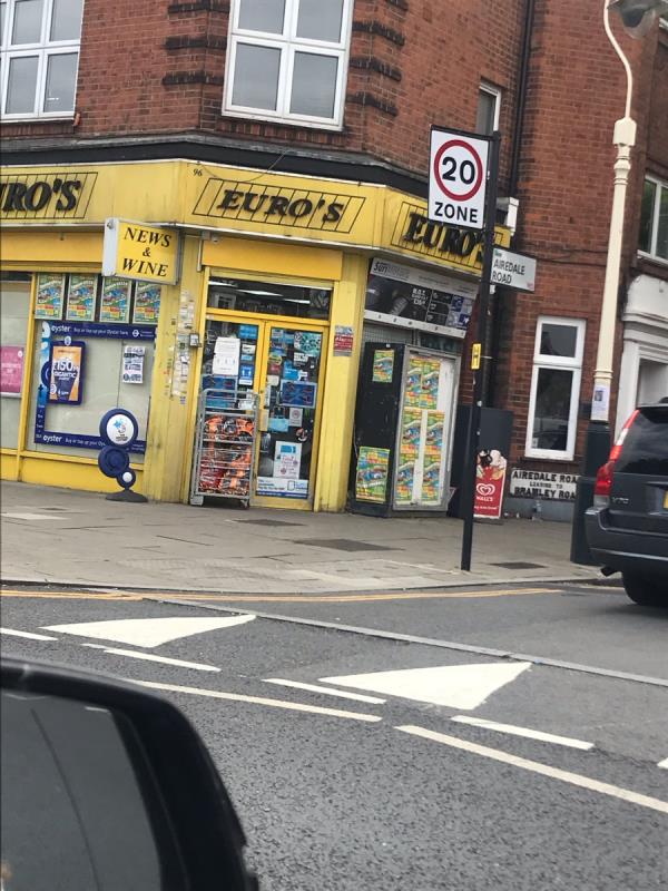 Fly posters advertising a fun fair in Turnham Green are attached to the side of a shop on South Ealing Road junction Airedale Road W5 -96 South Ealing Road, Ealing, W5 4QJ