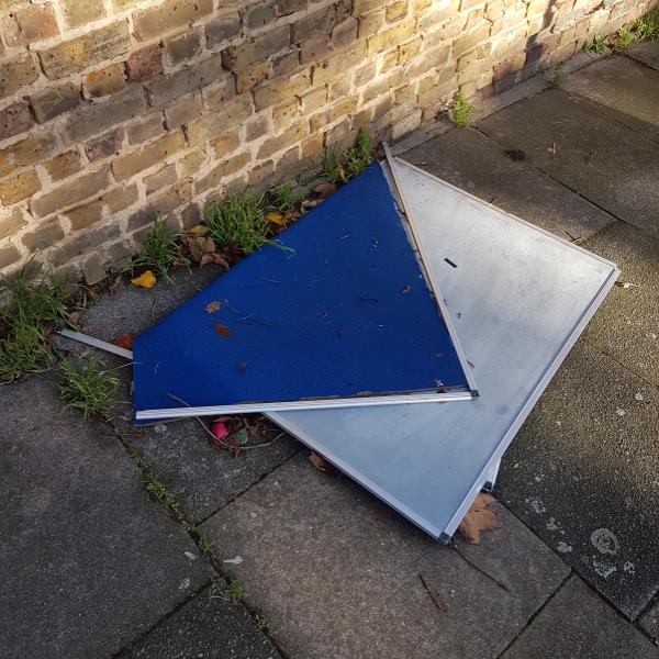 Boards dumped on pavement.-60 Dunoon Road, Forest Hill, SE23, England, United Kingdom