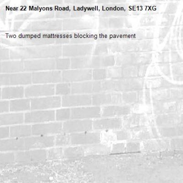 Two dumped mattresses blocking the pavement -22 Malyons Road, Ladywell, London, SE13 7XG