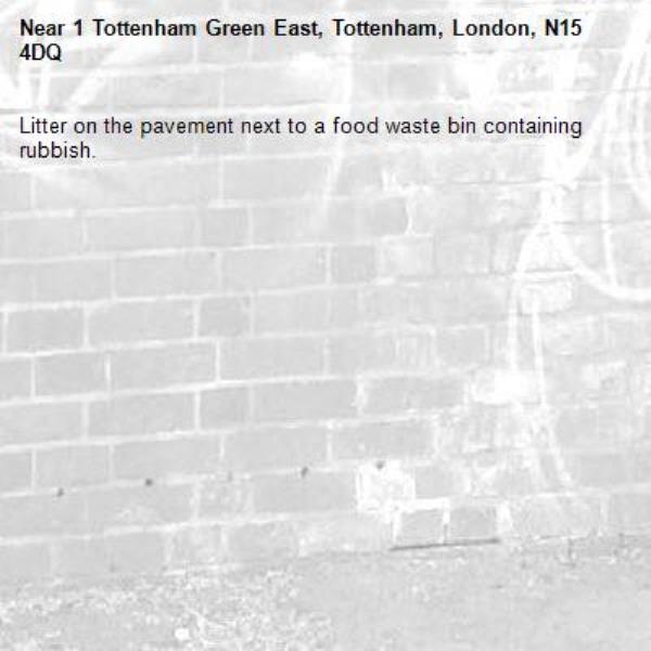 Litter on the pavement next to a food waste bin containing rubbish.-1 Tottenham Green East, Tottenham, London, N15 4DQ