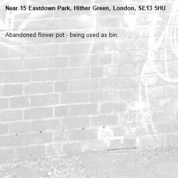 Abandoned flower pot - being used as bin. -15 Eastdown Park, Hither Green, London, SE13 5HU