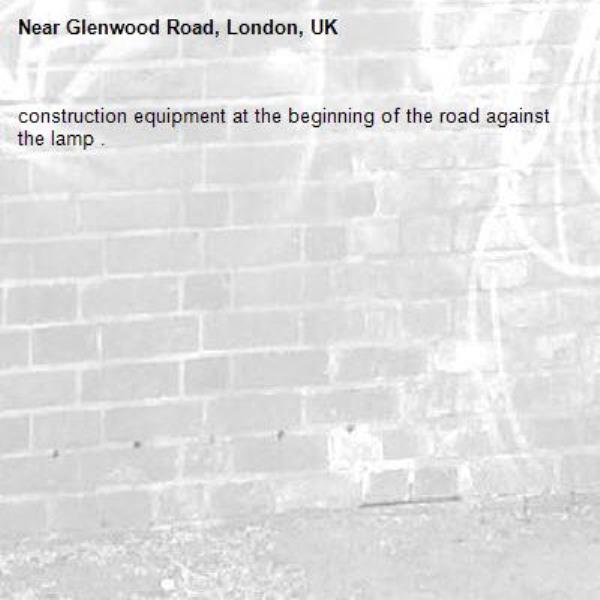construction equipment at the beginning of the road against the lamp .-Glenwood Road, London, UK