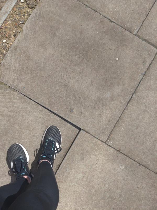 Wobbly paver, nearly tripped me up-Birdsmouth Court, Bathurst Square, Tottenham, London, N15 4FW