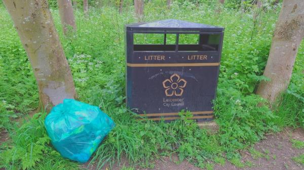 One bag mixed litter left at bin -Riverside Park