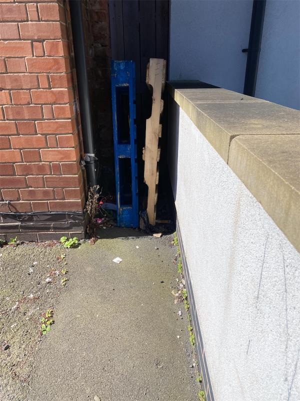 Two pallets. Been here a while. Other rubbish accumulating around them -Queen Elizabeth Apartments, 147 Queens Road, Leicester, LE2 3FQ