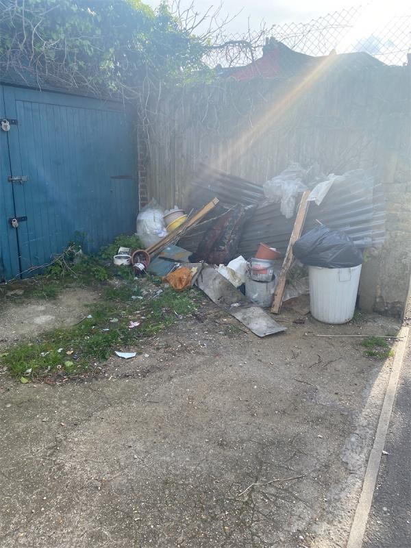 Lots of crap dumped by the garages next to Kensington school-School House, Kensington Avenue, Manor Park, London, E12 6NN