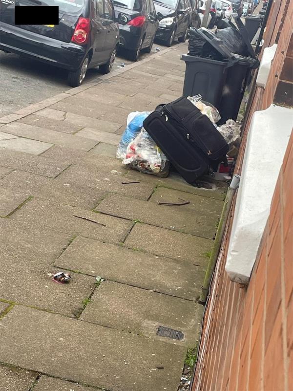 Suitcase dumped and residents wastes. I have ring camera footage showing the man dumping the waste his vehicle and his number plate. -110 Tewkesbury Street, Leicester, LE3 5HR