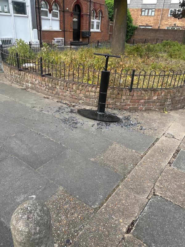 Flytipped object and shards of broken glass across pavement -15 Station Road, Forest Gate, London, E7 0ES