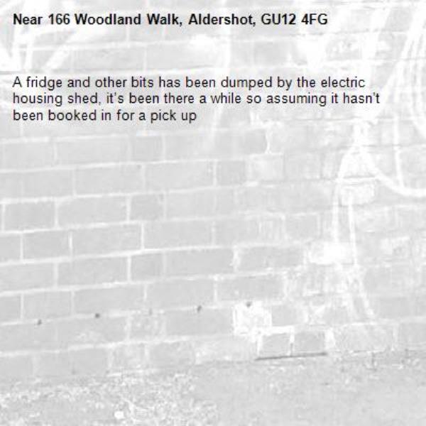 A fridge and other bits has been dumped by the electric housing shed, it’s been there a while so assuming it hasn’t been booked in for a pick up -166 Woodland Walk, Aldershot, GU12 4FG