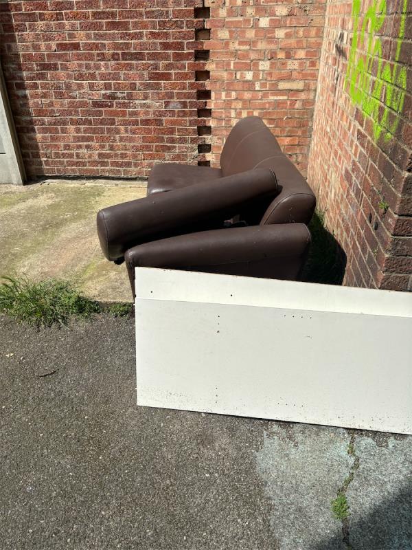 A leather sofa and wood needs picking up in Chenappa close it’s all around by the bins so can you pick up please -16 Chenappa Close, Plaistow, London, E13 8DZ
