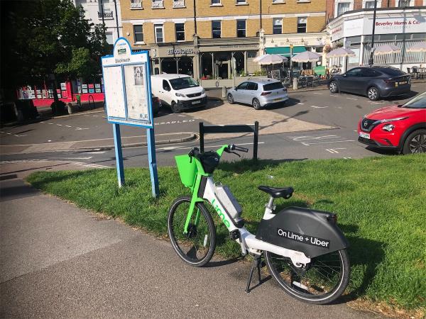 Opposite Wemyss Road. Please clear an Abandoned Lime bike-Kinleigh Folkard & Hayward, 25-27 Montpelier Vale, Blackheath, London, SE3 0TJ