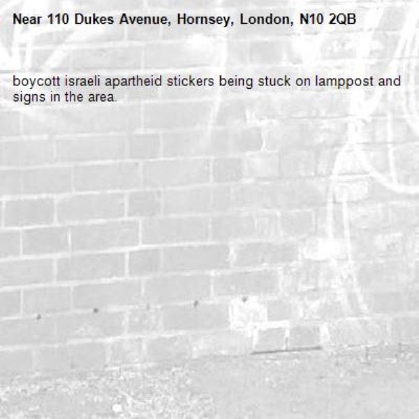 boycott israeli apartheid stickers being stuck on lamppost and signs in the area. -110 Dukes Avenue, Hornsey, London, N10 2QB