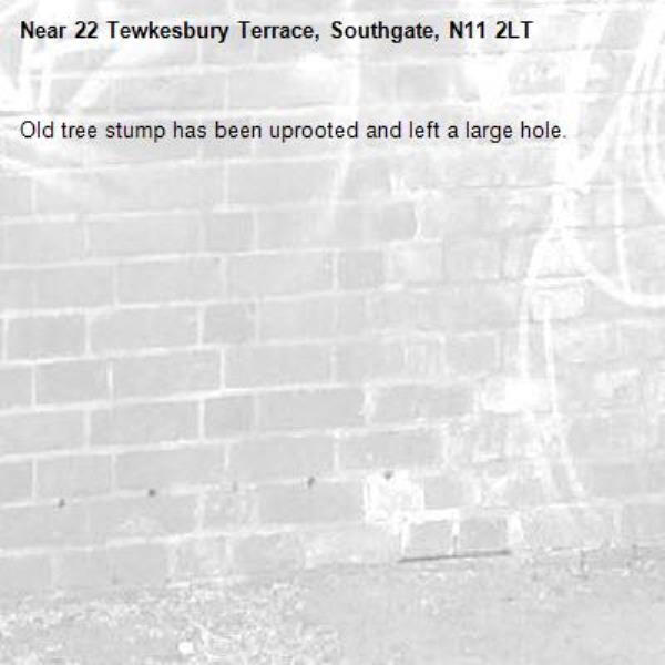 Old tree stump has been uprooted and left a large hole. -22 Tewkesbury Terrace, Southgate, N11 2LT