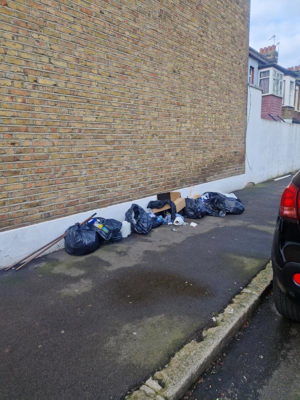 Rubbish dumped on pavement -66 Woodstock Road, Forest Gate, London, E7 8ND