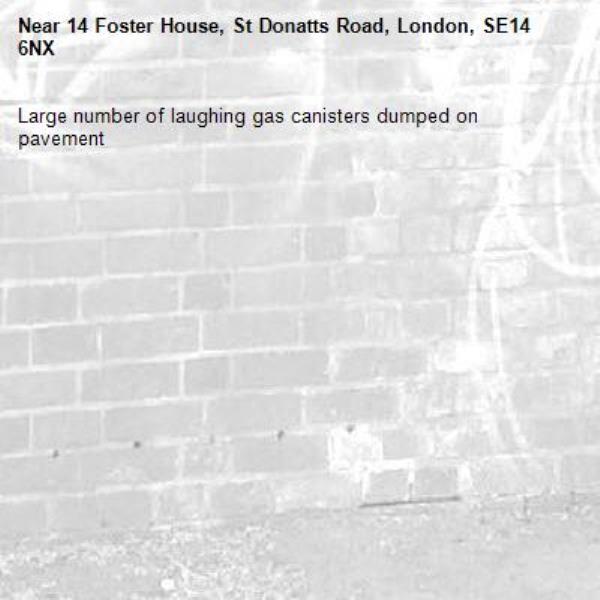 Large number of laughing gas canisters dumped on pavement -14 Foster House, St Donatts Road, London, SE14 6NX