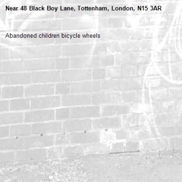 Abandoned children bicycle wheels-48 Black Boy Lane, Tottenham, London, N15 3AR