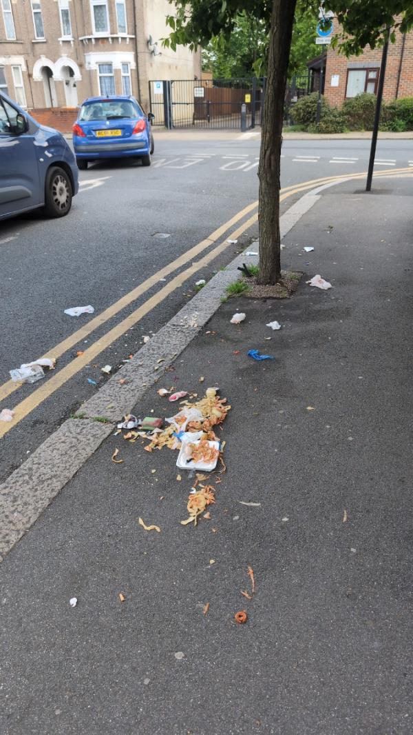 Rubbish bag left on the road ripped and spread onto pavement. Attracting foxes.  -72 Lawrence Road, East Ham, London, E6 1JW