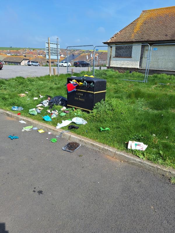 An overflowing bin at Fairlight car park Telscombe. Please put this in my tray as I have already emailed waste. Sent by Andy Strickland Neighbourhood First Advisor 07710066443-30 The Esplanade, Telscombe Cliffs, BN10 7EY