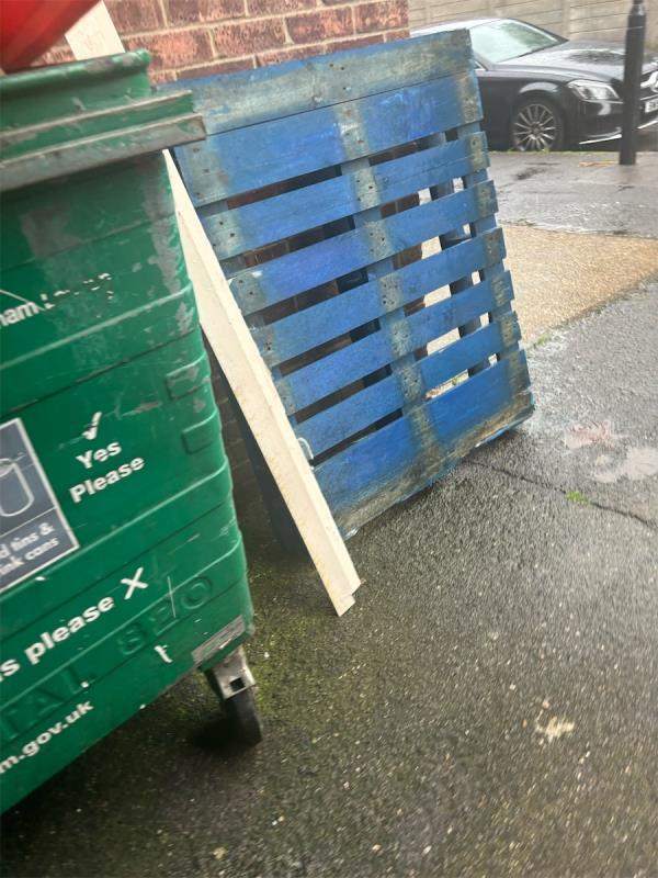 A wooden pallet and wood needs picking up by recycling bin please -16 Chenappa Close, Plaistow, London, E13 8DZ