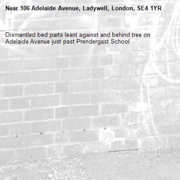 Dismantled bed parts leant against and behind tree on Adelaide Avenue just past Prendergast School-106 Adelaide Avenue, Ladywell, London, SE4 1YR