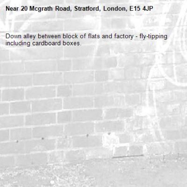 Down alley between block of flats and factory - fly-tipping including cardboard boxes.-20 Mcgrath Road, Stratford, London, E15 4JP
