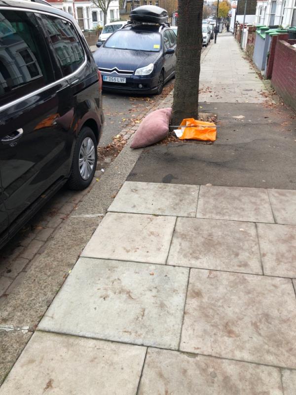 Pillow and plastic bag - pillow has been on street for over 2 weeks -102 Warham Rd, Harringay Ladder, London N4 1AU, UK