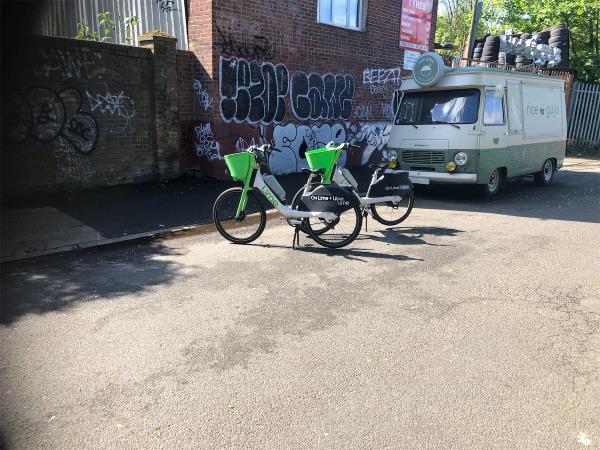 Rolt Street opposite Folkestone Gardens park. Please clear 2 lime bikes from road way-111 Rolt Street, London, SE8 5JZ