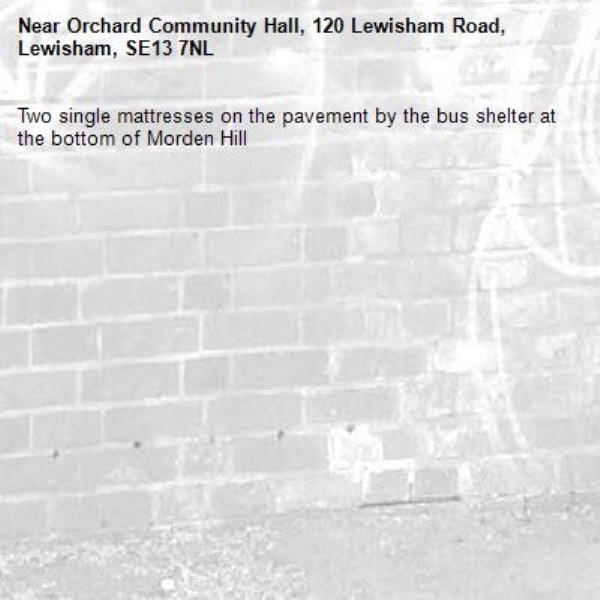 Two single mattresses on the pavement by the bus shelter at the bottom of Morden Hill-Orchard Community Hall, 120 Lewisham Road, Lewisham, SE13 7NL