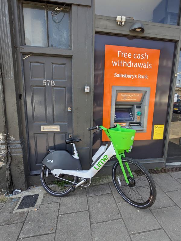 Lime Bike NGU-H5M blocking entrance (and fire exit) to 57B Honor Oak Park and preventing access to cash point.-57B Honor Oak Park, Crofton Park, London