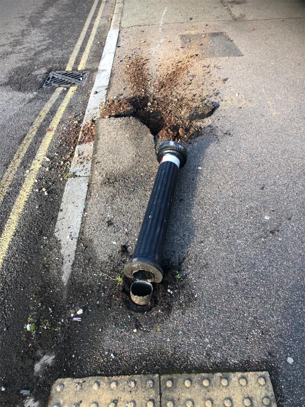 Metal bollard has been knocked over and tarmac raised-54 Randlesdown Road, Bellingham, London, SE6 3HB