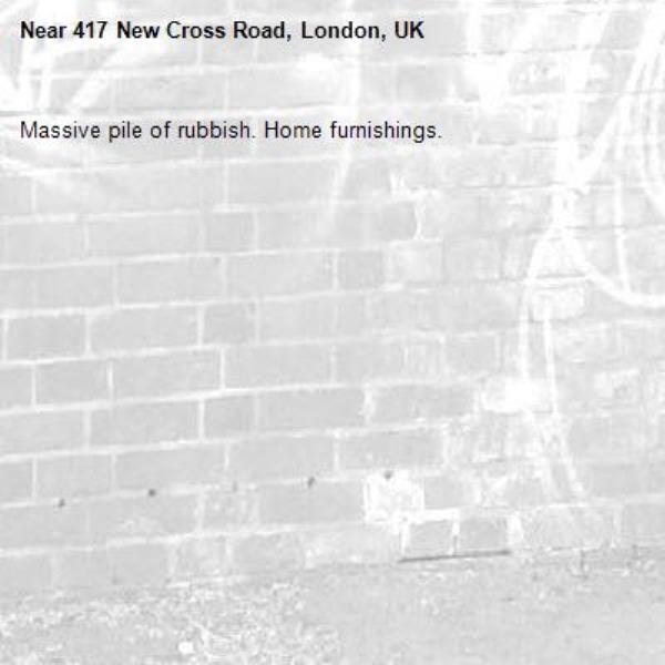 Massive pile of rubbish. Home furnishings.-417 New Cross Road, London, UK