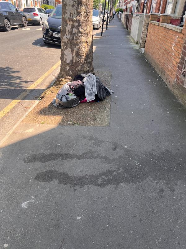 Bag of clothes by tree at 46 Lathom Road please clean thanks.-46 Lathom Road, East Ham, London, E6 2DX